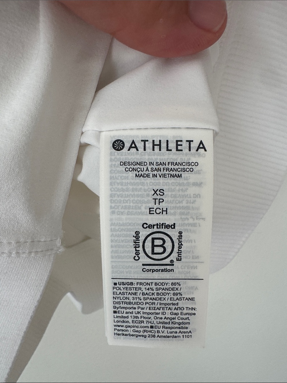 Athleta White Sleeveless Zip Polo with Navy Collar Trim - Picture 4 of 4
